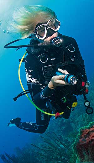 Scuba Diver underwater with a torch